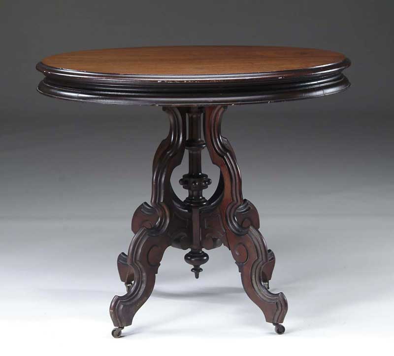 Appraisal: OVAL WALNUT VICTORIAN STAND Molded edge oval top supported by