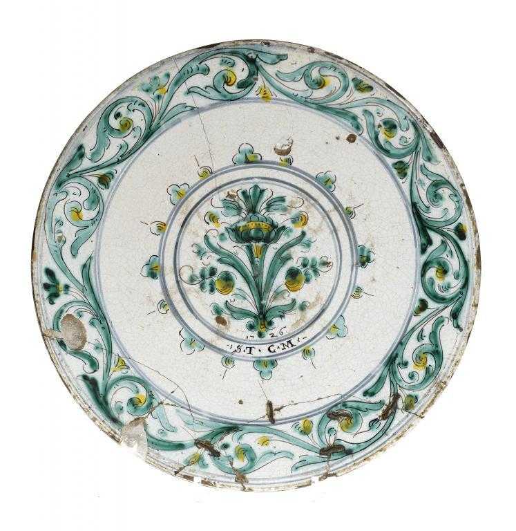 Appraisal: A DATED CONTINENTAL FAIENCE DISH PROBABLY SPANISH painted in green