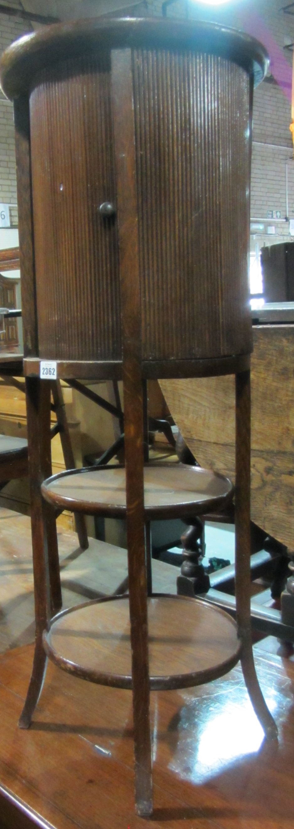 Appraisal: A th century oak four tier washstand with tambour cupboard