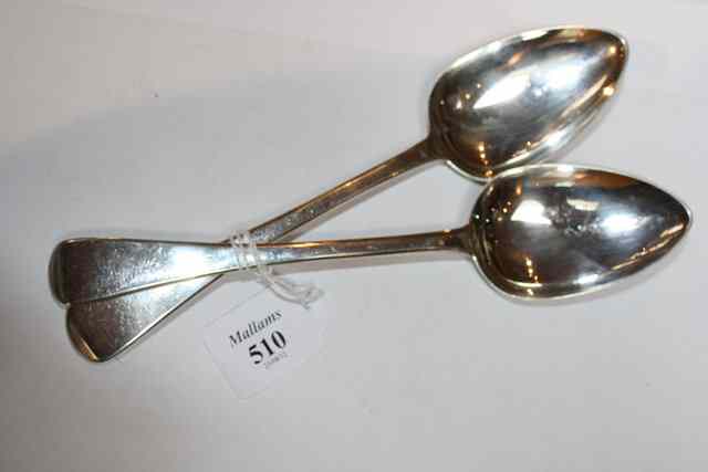 Appraisal: A PAIR OF GEORGE III SILVER OLD ENGLISH PATTERN TABLESPOONS