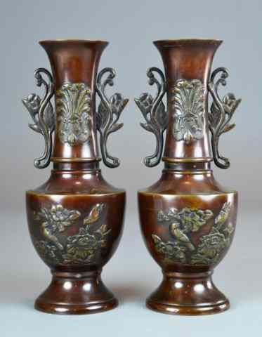 Appraisal: Japanese Pair of Matching Bronze VasesMatching pair of urn-shaped footed