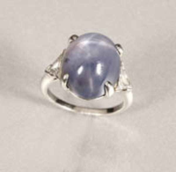 Appraisal: A star sapphire and diamond ring Marcus A star sapphire