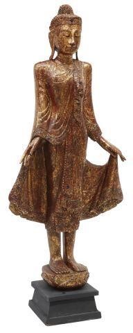 Appraisal: Southeast Asian carved wood sculpture Buddha the standing figure finished