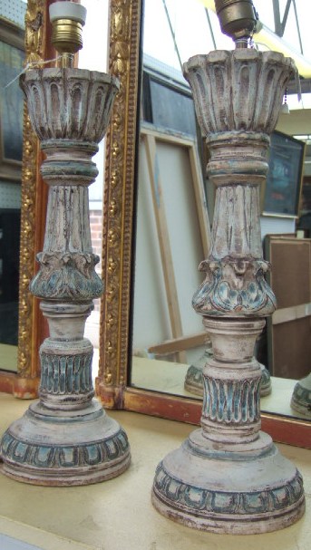 Appraisal: A pair of th century carved and painted table lamps