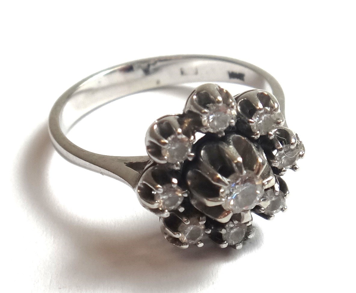 Appraisal: A white gold and diamond set nine stone cluster ring