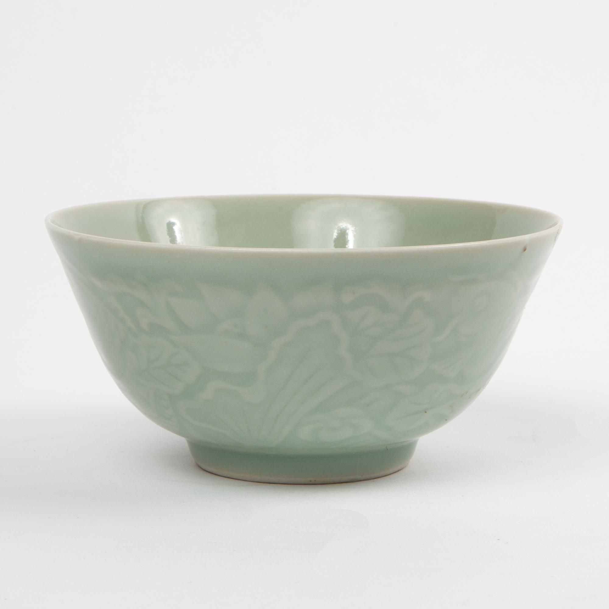 Appraisal: CHINESE CARVED CELADON BOWL A th c Chinese stoneware bowl