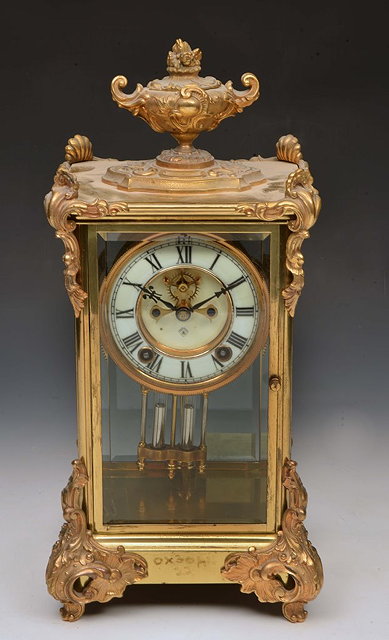 Appraisal: A FRENCH FOUR GLASS MANTEL CLOCK with white enamel dial