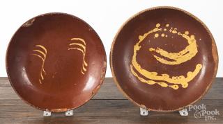 Appraisal: Two redware deep dishes th c with yellow slip decoration