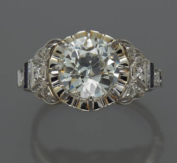 Appraisal: A diamond ring centering a European-cut diamond central diamond weighing