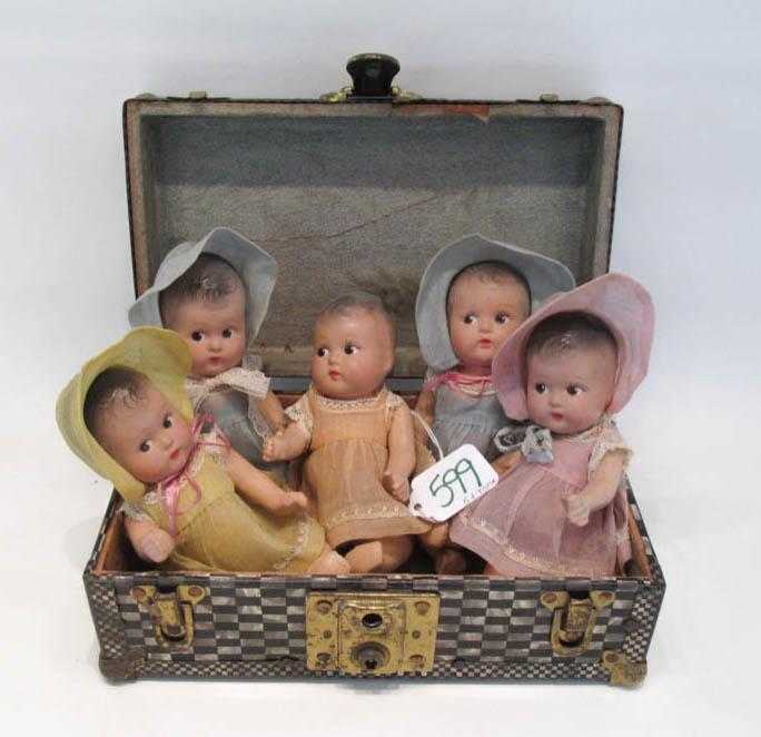 Appraisal: FIVE COMPOSITION QUINTUPLET DOLLS WITH TRUNK each doll with original