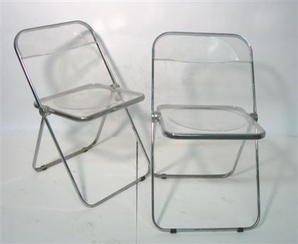 Appraisal: Two Plia Italian design lucite folding chairs Designed by Piretti