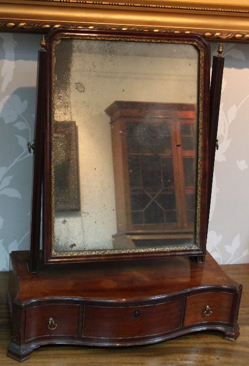 Appraisal: A George III mahogany swing-frame toilet mirror the rectangular plate