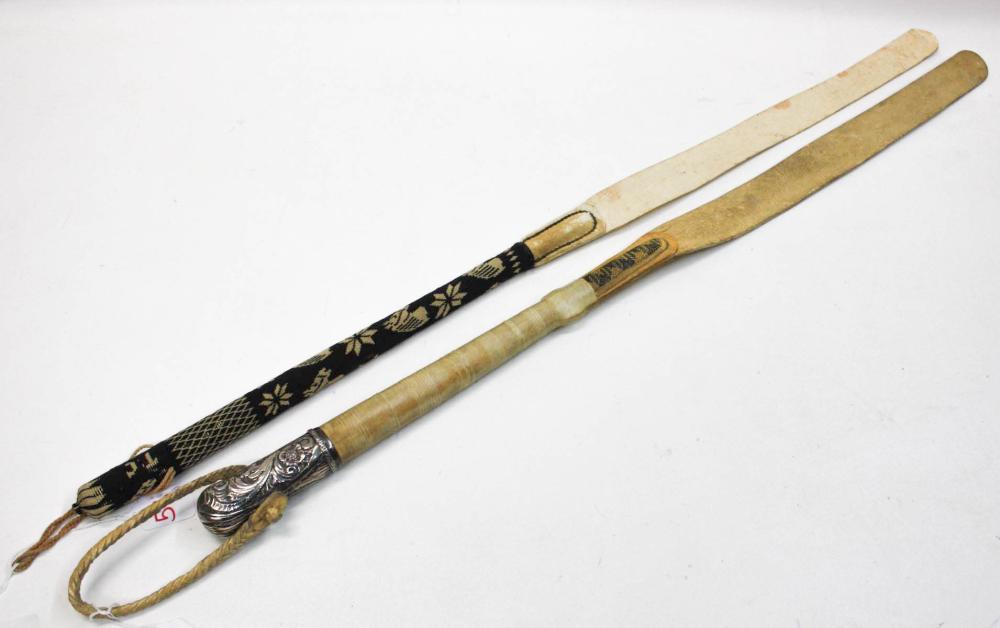 Appraisal: TWO VINTAGE GAUCHO TYPE RIDING CROPS the first having a