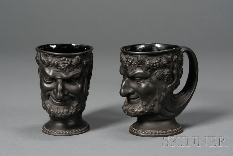 Appraisal: Pair of Turner Black Basalt Satyr Mugs England c each