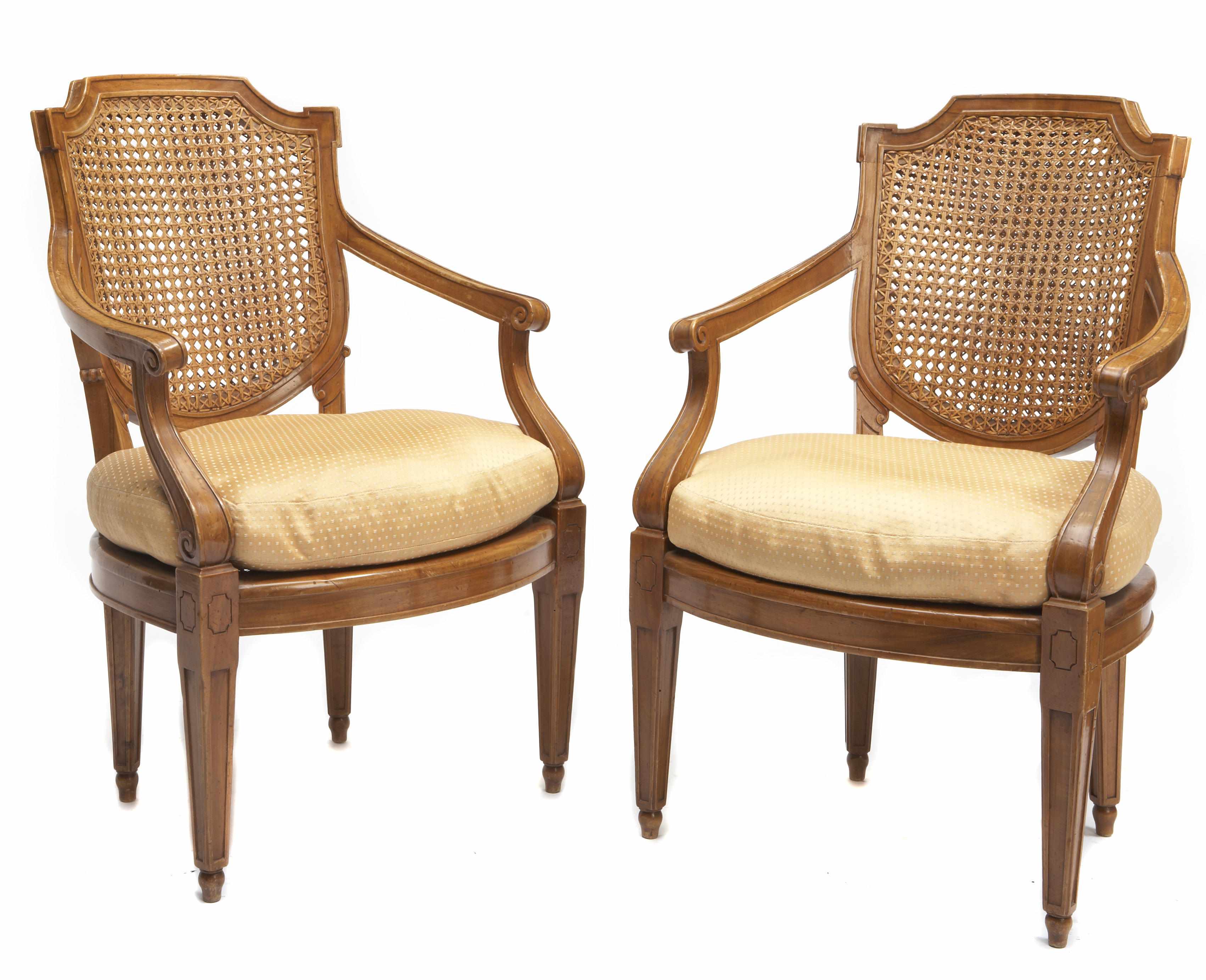 Appraisal: A pair of Louis XVI style fruitwood and cane paneled