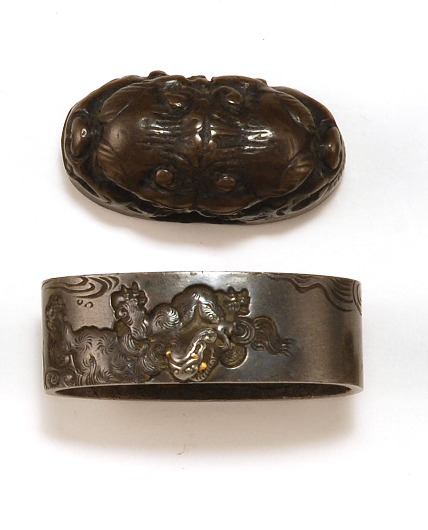 Appraisal: PAIR OF SENTOKU FUCHI KASHIRA th CenturyBy Hiroyuki Depicting shishi