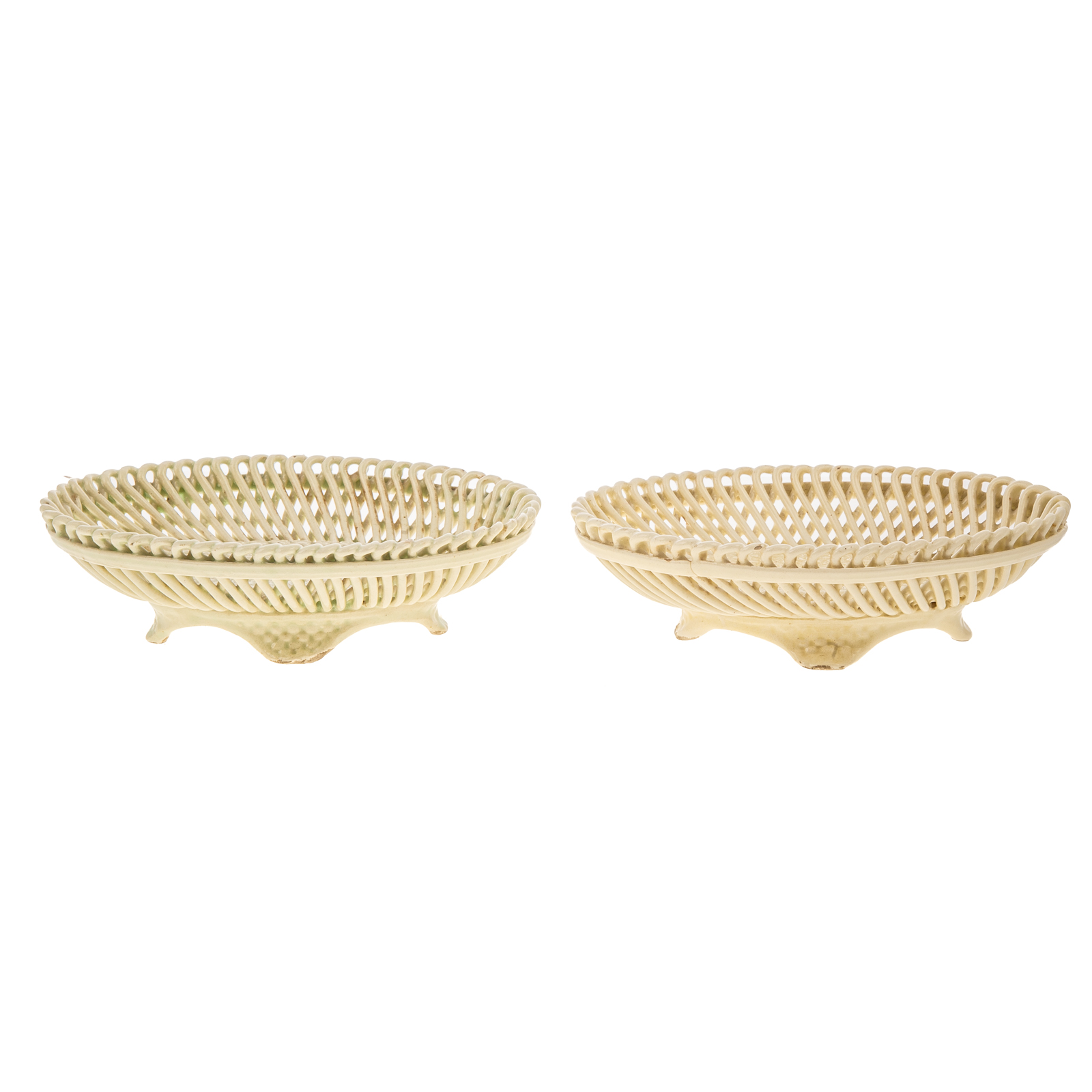 Appraisal: A PAIR OF STAFFORDSHIRE CREAMWARE RETICULATED BASKETS Circa with molded