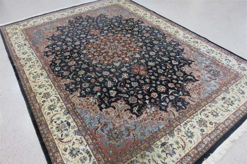 Appraisal: HAND KNOTTED ORIENTAL CARPET Pakistani-Persian floral and central floral medallion