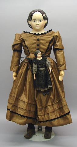 Appraisal: Pair of papier mache dolls with black molded hair and