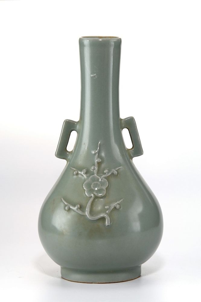 Appraisal: Light Green Vase The compressed body resting on a everted