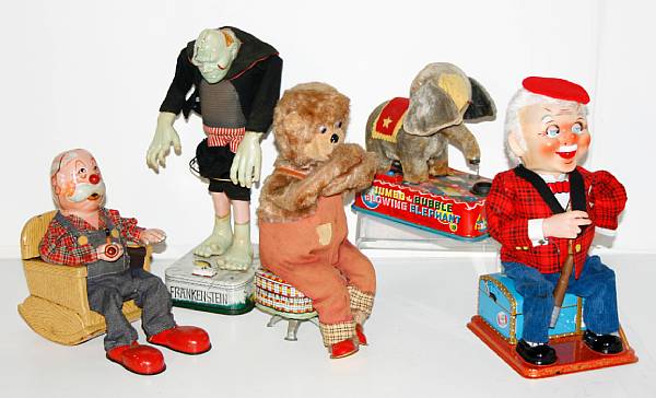 Appraisal: Grouping of Comical Battery Operated Toys Mid th Century Japanese