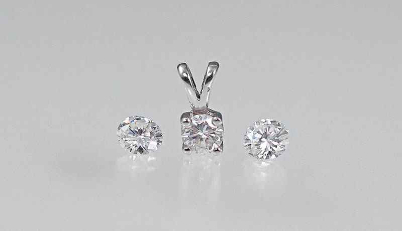 Appraisal: DIAMOND SOLITAIRE PENDANT AND DIAMONDS FOR YOUR OWN DESIGN K