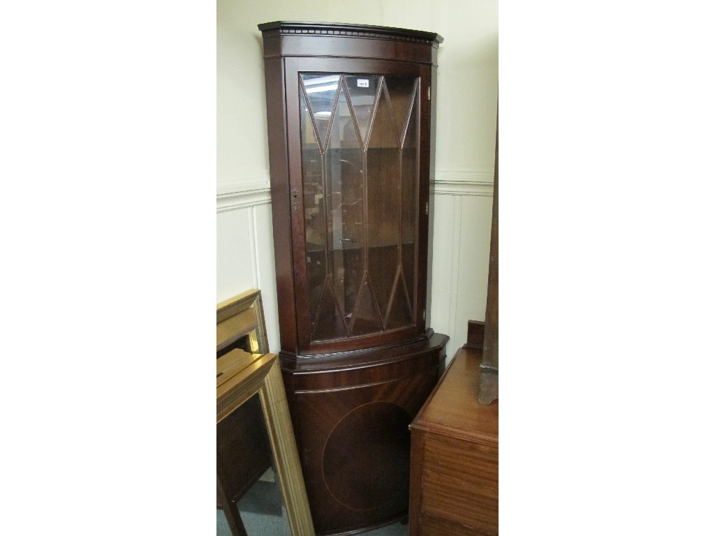 Appraisal: Reproduction corner cabinet and a reproduction open bookcase