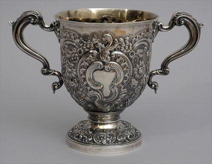 Appraisal: GEORGE III REPOUSS SILVER TWO-HANDLED CUP Robert Garrard London the