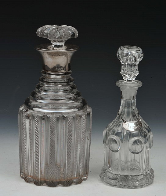 Appraisal: A GEORGIAN FLUTED GLASS SPIRIT DECANTER with hobnail decoration and