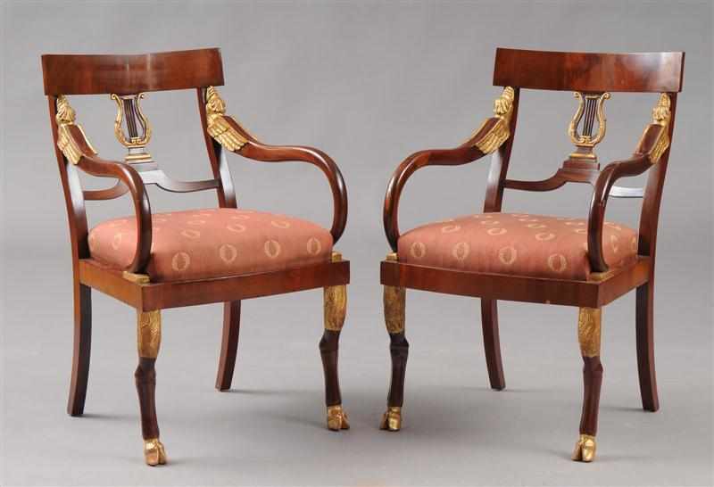 Appraisal: PAIR OF RUSSIAN NEOCLASSICAL STYLE CARVED AND PARCEL-GILT MAHOGANY FAUTEUILS