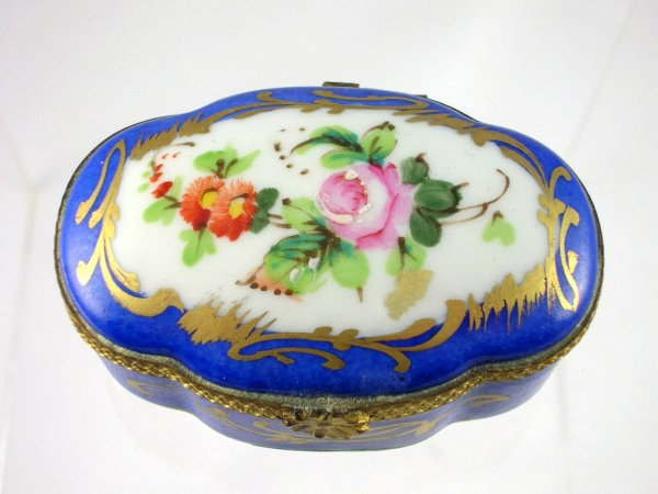 Appraisal: Limoges porcelain box with brass mounts signed under base Pient