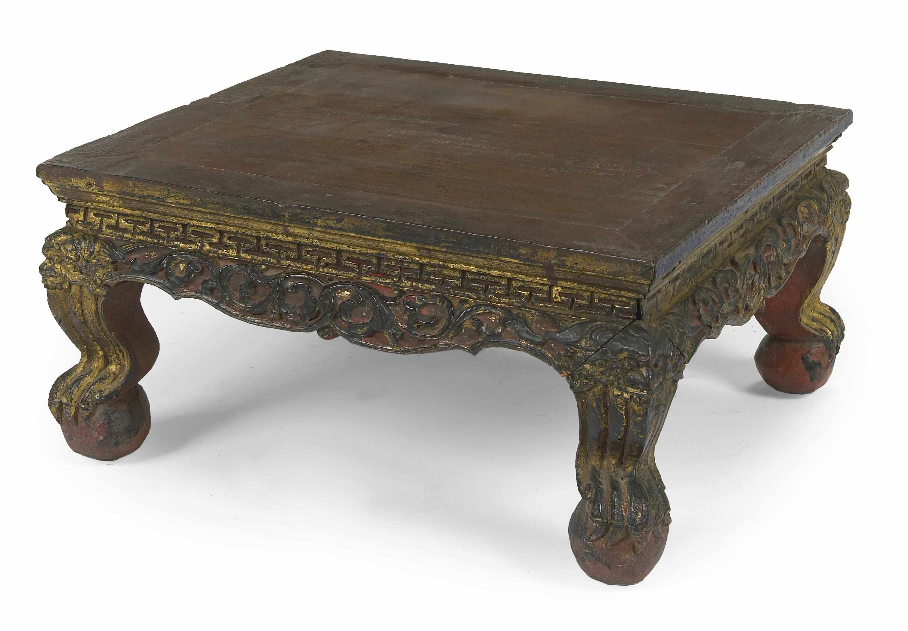 Appraisal: A Chinese carved parcel gilt and ebonized wood rectangular stand