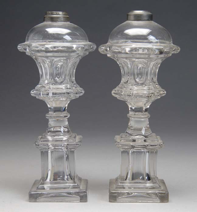 Appraisal: MATCHED PAIR OF CLEAR MOLDED WHALE OIL LAMPS Press waisted