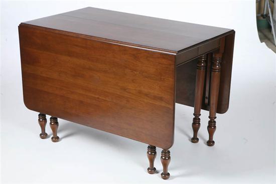 Appraisal: WILLETT DROP LEAF TABLE Large cherry table with turned legs