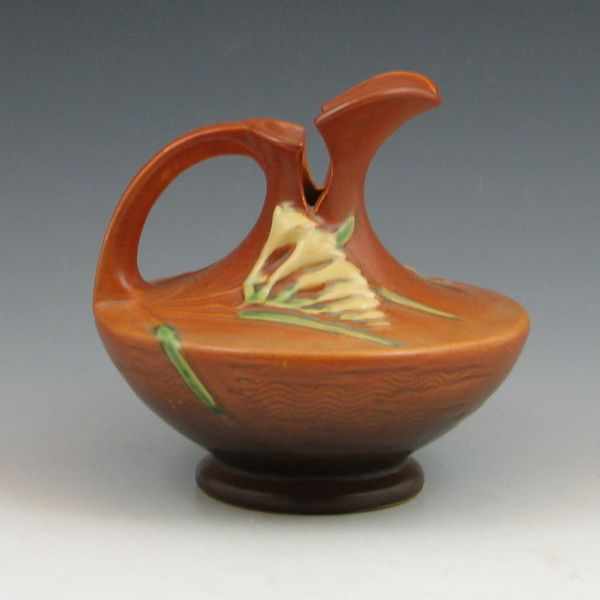 Appraisal: Roseville Freesia ewer in brown Marked Roseville USA - ''