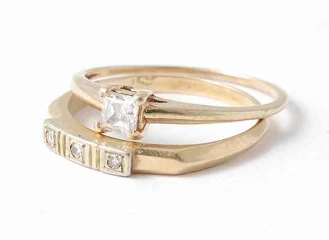 Appraisal: TWO DIAMOND AND FOURTEEN KARAT GOLD RINGS solitaire version with