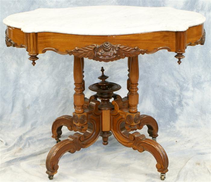 Appraisal: Carved walnut Victorian Rennaissance Revival turtle shaped white MT table