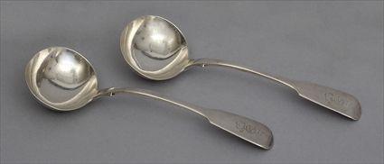 Appraisal: PAIR OF EARLY VICTORIAN ARMORIAL SILVER SAUCE LADLES John Henry