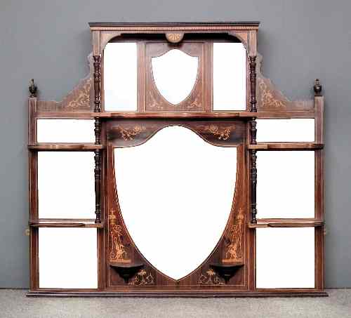 Appraisal: A late Victorian rosewood framed overmantel mirror inlaid with boxwood