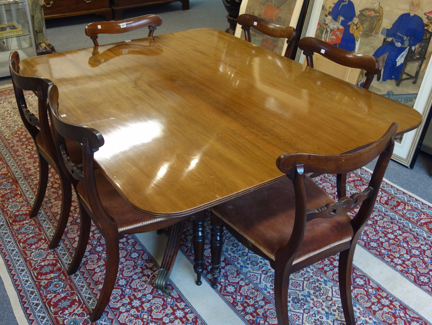 Appraisal: A George IV mahogany rectangular snap top dining table on