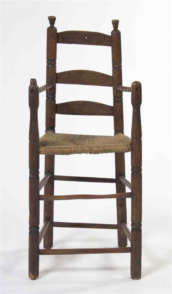 Appraisal: A Provincial Ladder Back Child's Chair having three horizontal splats