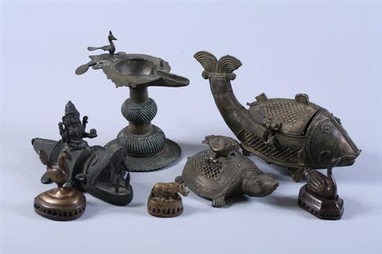 Appraisal: SEVEN PIECES INDIAN BRONZE One oil lamp with bird finial