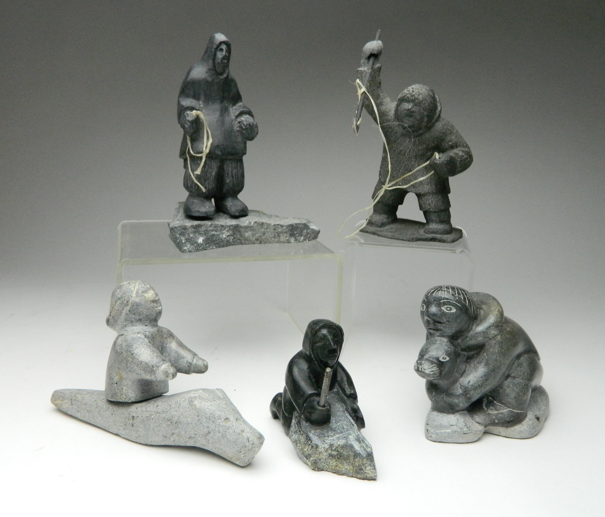 Appraisal: Inuit stone carvings Arnakallak Pond Inlet- Man in Kayak ''