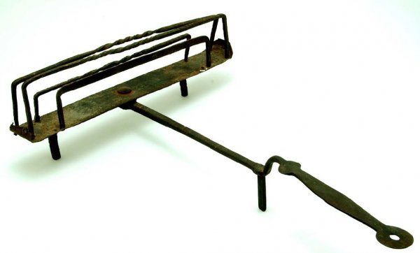 Appraisal: Wrought iron footed toaster used in an open fire place