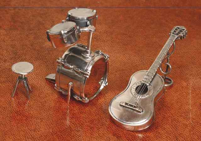 Appraisal: A CONTINENTAL MINIATURE SILVER DRUM SET AND STOOL high and