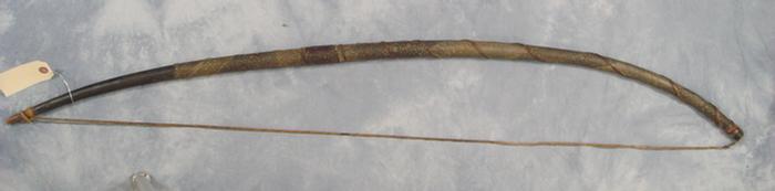 Appraisal: Native American bow wrapped with snakeskin long Estimate -