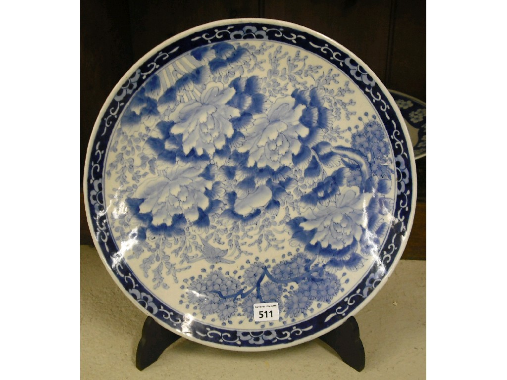 Appraisal: Japanese blue and white charger decorated overall with chrysanthemums amidst