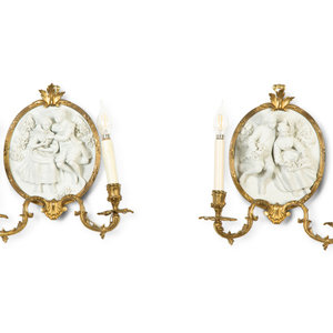 Appraisal: A Pair of Continental Plaster Relief Medallion and Gilt Bronze