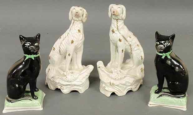 Appraisal: Pair of th c Staffordshire seated game dogs h and