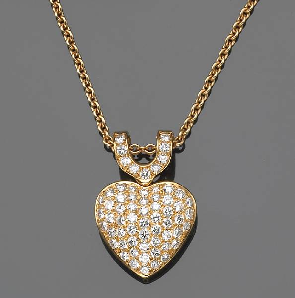 Appraisal: A diamond and k gold heart-shape enhancer with chain Cartier